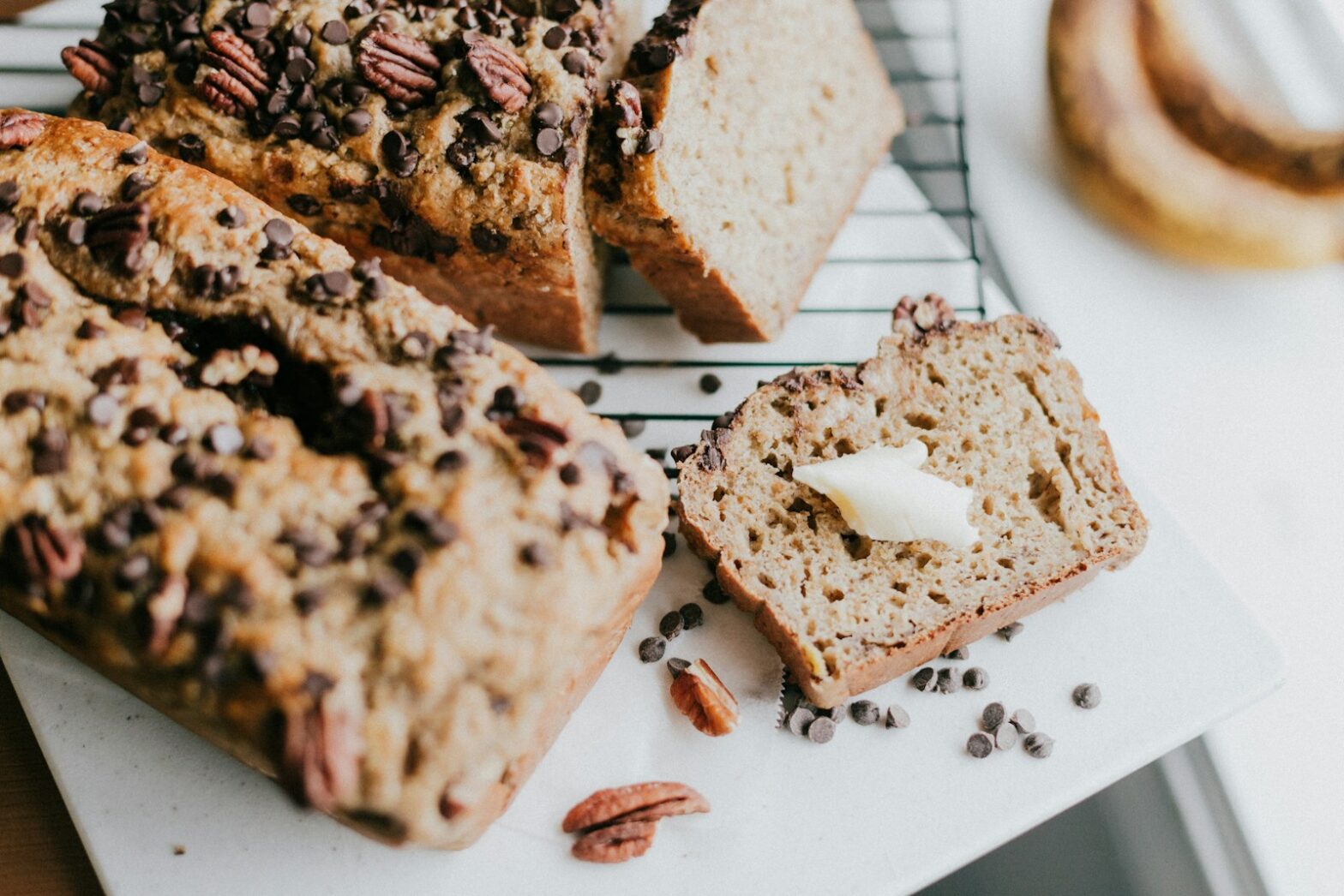 brown bread on white ceramic plate, coconut palm sugar, coconut secret coconut nectar, young coconut, dry coconut