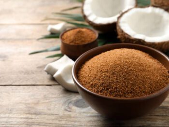 Natural coconut sugar in bowl on wooden table, space for text natural coconut sugar, coconut sugar, coconut sugar, coconut, coconut nectar, coconut flowersweeteners, coconut, glycemic index, coconut sugar, healthy, diet, coconut sugar, natural coconut sugar, coconut powder, sweeteners