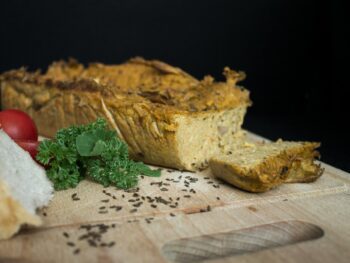 sliced bread with green vegetable on white and brown floral textile {{brizy_dc_image_alt entityId=